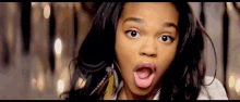 a woman with a surprised look on her face .
