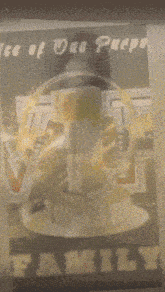 a blurred image of a person holding a cup of coffee with the words " family " on the bottom