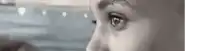 a close up of a person 's eye looking out a window .