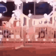 a blurry picture of a carousel with a sign that says ' i love you '
