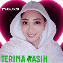 a woman wearing a white hoodie with the words terima kasih written on the bottom
