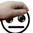 a hand is holding a smiley face with a serious face .