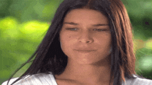 a close up of a woman 's face with a blurred background