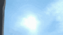 the sun is shining through the clouds in a blue sky