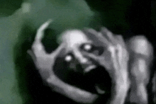 a black and white drawing of a scary face with a skull on it