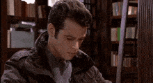 a person is reading a book on a table