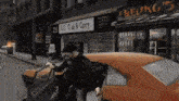 a man getting out of a car in front of a beung 's store