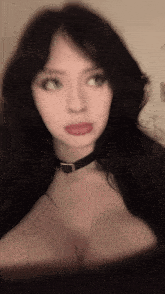 a blurry photo of a woman with long black hair