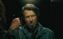 a man with a beard is giving a fist bump with the words good timezone behind him