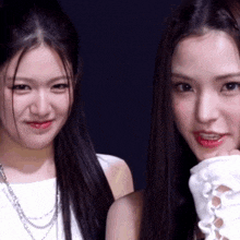 two women are posing for a picture with one wearing a white glove
