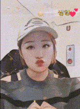 a woman wearing a baseball cap with the letter u on the bottom