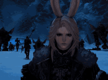 a woman with bunny ears stands in front of a group of people