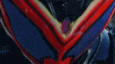 a close up of a red and purple helmet with glowing eyes
