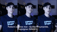 a man wearing a levi 's t-shirt is talking into a microphone