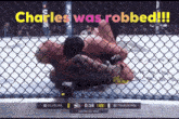 a boxing match with the words " charles was robbed " on the top