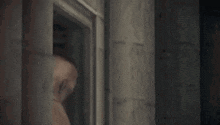 a close up of a man 's back with blood on it in a dark room .