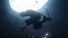a man is swimming in the water with a microphone