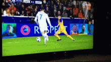 a soccer game is being played on a television screen