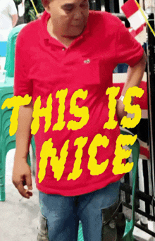a man in a red shirt that says this is nice on it