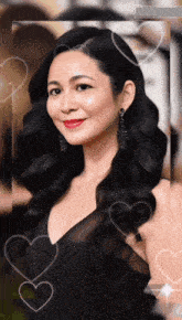 a woman in a black dress with hearts surrounding her