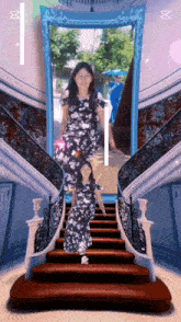 a woman in a floral dress is walking down stairs