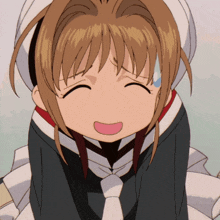a close up of a girl with her eyes closed and a surprised look on her face