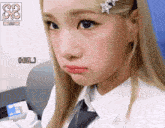 a close up of a girl 's face with the number 88 behind her