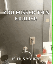 a bathroom with a sign that says you missed this earlier