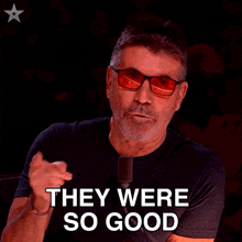 a man wearing red glasses is giving a thumbs up and saying they were so good