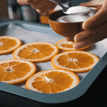 Adding Sugar On Top Of Sliced Orange Two Plaid Aprons GIF