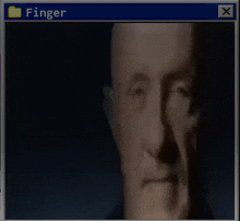 a man 's face is displayed in a window with the word finger above it