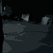 a man is running in the dark in a dark room .