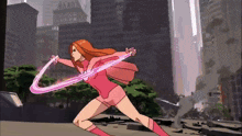 a woman in a pink superhero outfit is holding a purple object