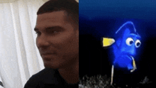 a man next to a picture of a cartoon character