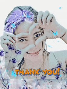 a woman making a heart with her hands and the words thank you written below her