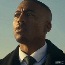 a close up of a man 's face with netflix written on the bottom right