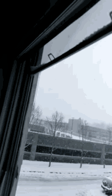 a window with a view of a snowy street