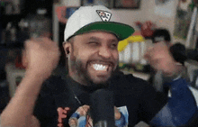 a man wearing a white hat and a black shirt is making a funny face