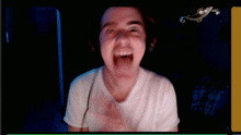 a man wearing headphones making a funny face