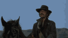 a man in a cowboy hat rides a horse in the desert