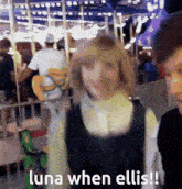 a woman walking in front of a merry go round with the words luna when ellis on the bottom