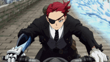 a man with red hair is riding a motorcycle wearing a black suit and tie