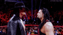 The Undertaker Roman Reigns GIF - The Undertaker Roman Reigns Chokeslam GIFs