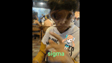 a person wearing a white shirt that says sigma