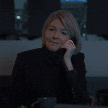 a woman talking on a phone with the text enjoy your night