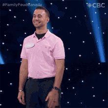 a man in a pink shirt with the name barc on it