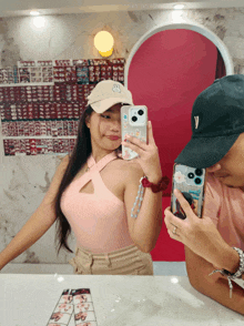 a man and a woman are taking a picture of themselves in the mirror