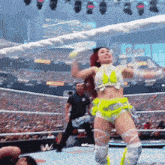 a woman in a wrestling ring with the hashtag tiffanyluv24 on the bottom