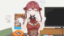 a red haired anime girl is sitting in front of a tv