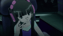 a girl with headphones on her head is sitting in a chair